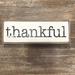 Gracie Oaks Thankful Letter Block Wood in Black/Brown/White | 4 H x 11 W x 1 D in | Wayfair BA4A4131EA414C8280A9A146D3CEA649