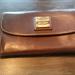 Dooney & Bourke Bags | Genuine Leather Purse. | Color: Brown | Size: Os