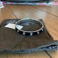 Coach Jewelry | Coach Thin Grommet Bangle. Black/Silver. Nwt | Color: Black/Silver | Size: Os