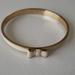 Kate Spade Jewelry | Kate Spade Beige Bow Bangle | Color: Cream/Gold | Size: Os