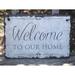 Gracie Oaks Irasburg Welcome To Our Home Wall Décor Stone in Gray | 8 H x 12 W in | Wayfair 49FC525F307E4C6686D9058068C8BB7B