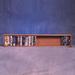 Rebrilliant 50 VHS Wall Mounted Multimedia Storage Rack Wood/Solid Wood in Brown | 52 H x 9.5 W x 5.5 D in | Wayfair