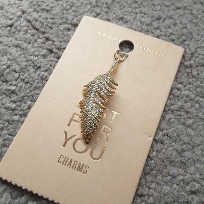 Anthropologie Jewelry | Anthropologie Crystal Feather Charm Nwt! | Color: Gold | Size: Os