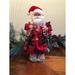 The Holiday Aisle® 12" Merry Christmas Claus Resin | 14 H x 7 W x 5 D in | Wayfair 139512F8DE3E4181AC892FBEE85FBA71