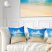 Designart 'Cloudy Horizon Over Blue Sea' Seashore Photo Throw Pillow