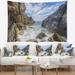 Designart 'Sea Waves Hitting Rocky Shore' Modern Seascape Wall Tapestry