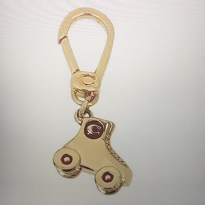 Coach Jewelry | Coach - Collectible Roller Skate Charm (Nwt) | Color: Gold/Red | Size: Os
