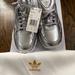 Adidas Shoes | Adidas Falcon Women’s Silver Sneaker | Color: Silver/White | Size: 5.5