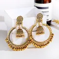 Boucles d'oreilles Jhumka indiennes sculptées en or pour femmes grandes boucles d'oreilles rondes