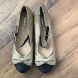 Anthropologie Shoes | Black And Beige Mary Jane Flats With Bow | Color: Black/Cream | Size: 7