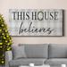 The Holiday Aisle® This House Believes Premium Gallery Wrapped Canvas - Ready To Hang Canvas, Solid Wood in White | 16 H x 8 W x 1 D in | Wayfair