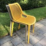 AllModern Farrah Stacking Patio Dining Chair Plastic/Resin in Yellow | 32.3 H x 19.7 W x 23.6 D in | Wayfair A7C4368C8AD74951B7B886FEF5F9D151