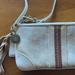 Coach Bags | Coach Cream And Tan Canvas Suede Wristlet With Tassel | Color: Cream/Tan | Size: 3.5 X 7”