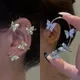 Clips d'oreille papillon en cristal plaqué argent pour femmes Zircon étincelant boucles