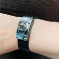 Coach Jewelry | Coach Black Leather Cuff Bracelet With Shiny Silver Tone Metal Turnlock | Color: Black/Silver | Size: Os