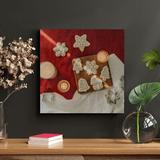 The Holiday Aisle® Christmas Design Cookies On Red & White Garment & Three Lighted Candles | 12 H x 12 W x 2 D in | Wayfair