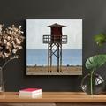 Highland Dunes Brown en Lifeguard Tower On Beach During Daytime - 1 Piece Square Graphic Art Print On Wrapped Canvas in Black/Blue/Brown | Wayfair