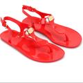 Michael Kors Shoes | Michael Kors Coral Red, T-Strap Jelly Sandals With Gold Michael Kors Logo Plate. | Color: Orange/Red | Size: 7