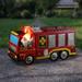 Exhart Solar Fire Truck Driving Gnome Garden Statue Resin/Plastic in Red | 6.5 H x 11.5 W x 6 D in | Wayfair 74333-RS
