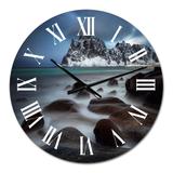 Designart 'Rocky Coast With Mountains' Nautical & Coastal wall clock