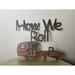 Trinx How We Roll Sign Wall Décor Metal in Brown/Gray | 10 H x 8 W x 2 D in | Wayfair 49D7D8696FA64D3296651A3A5EACCF77