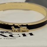 Coach Jewelry | Coach Nwtstunning Black & Gold Bangle W/Classic Horse & Carriage Design! | Color: Black/Gold | Size: Os