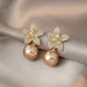 Boucles d'oreilles pendantes de fleur de perle d'or rose pour des femmes argent plein biscuits
