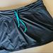 Athleta Skirts | Athleta Black & Teal Mini Tennis Skirt | Color: Black/Blue | Size: M
