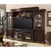 Lark Manor™ Akrm Solid Wood Entertainment Center for TVs up to 70" Wood in Brown | Wayfair 5104DA76CB904610A1111D681D8CB4BA