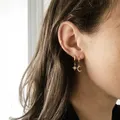 Boucles d'oreilles pendantes de tempérament d'étoile de cristal délicat contracté pour les femmes