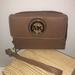 Michael Kors Accessories | Michael Kors Wristlet Excelent Condition | Color: Tan | Size: Os