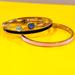 Kate Spade Jewelry | Kate Spade Bangle - Gold, Purple Signature Spade, Cubic Zirconia - Hinge | Color: Gold/Purple | Size: Os