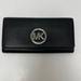 Michael Kors Bags | Michael Kors Fulton Silver-Tone Logo Carryall Pebbled Leather Wallet | Color: Black | Size: Os