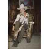 Roy Rogers slipping on cowboy boots brown pants hat 24x36 Poster