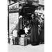 Paris: Milk Dispenser C1915./Nan Automatic Milk Dispenser On A Street In Paris France. Photograph C1915. Poster Print by (24 x 36)