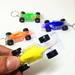 HGYCPP Mini Racing LED Light-Up Toys Keychain Party Favors Kids Toy Gift Gadgets Bag Pendant