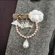 Élégant luxe femmes strass camélia perle pendentif chaînes broches exquisite noir blanc tissu perle