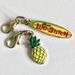 Disney Jewelry | Disney Lilo & Stitch Charm Clip-On Surfboard Pineapple Zipper Pull Purse Aulani | Color: Green/Yellow | Size: Os