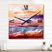 Designart 'Boat On The Ocean During VIbrant Sunset' Nautical & Coastal Wall Clock Decor