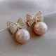 Boucles d'oreilles pendantes en perles de champagne pour femmes nœud de tempérament bijoux exquis