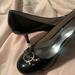 Michael Kors Shoes | Michael Kors Designer Black Patent Leather Pumps Heels Shoes W/Mk Silver Logo. | Color: Black | Size: 8.5