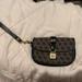 Dooney & Bourke Bags | Dooney & Bourke Bags | Dooney And Bourke Signature Flap Wristlet | Color: Black/Gray | Size: Os