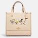 Coach Bags | Coach X Peanuts Dempsey Tote 22 With Snoopy And Friends Ice Skating, Very Cute!! | Color: Cream | Size: Large