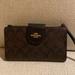 Coach Bags | Authentic-Tech Wallet In Colorblock Signature Canvas- Lightly Used | Color: Black/Brown | Size: 7 1/4" (L) X 4 1/2" (H)