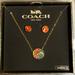 Coach Jewelry | Coach Horse Carriage Crystal Necklace And Stud Earrings Set, 16" + 2" Extension | Color: Gold/Red | Size: Os