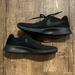 Nike Shoes | Black Nike Tanjun Sneakers | Color: Black | Size: 10