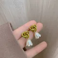 Boucles d'oreilles pendantes coréennes pour femmes fleur nouée verte unique boucles d'oreilles