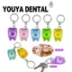 Porte-clés en forme de dent pour les soins des gencives fil dentaire livres de dents soins
