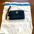Tory Burch Bags | Brand New, Never Used Black Tory Burch Wristlet Wallet With Gold Hardware. | Color: Black/Gold | Size: 6” Wide X 3 1/2” Height X 3/4” Deep
