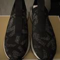 Michael Kors Shoes | Michael Kors Slip On Tennis Shoe, Black With Silver Mk Logo Print, Size 7 1/2 | Color: Black | Size: 7.5